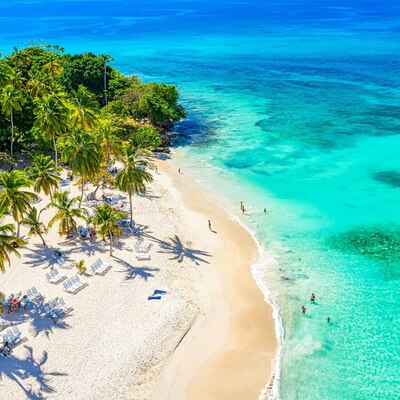 Aerial drone view of the beautiful small island and palm trees of Atlantic Ocean. Cayo Levantado island, Samana, Dominican Republic